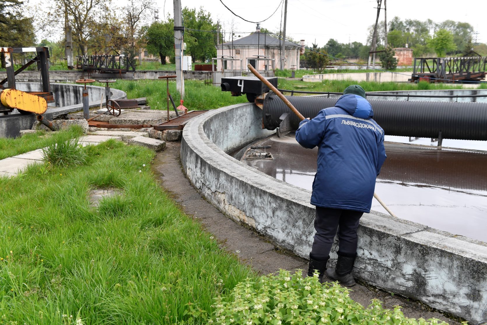 Man cleaning water system